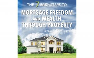 A house with light up windows against a cloudy sky with the words "The 7 Easy steps to Mortgage freedom and Wealth through Property"